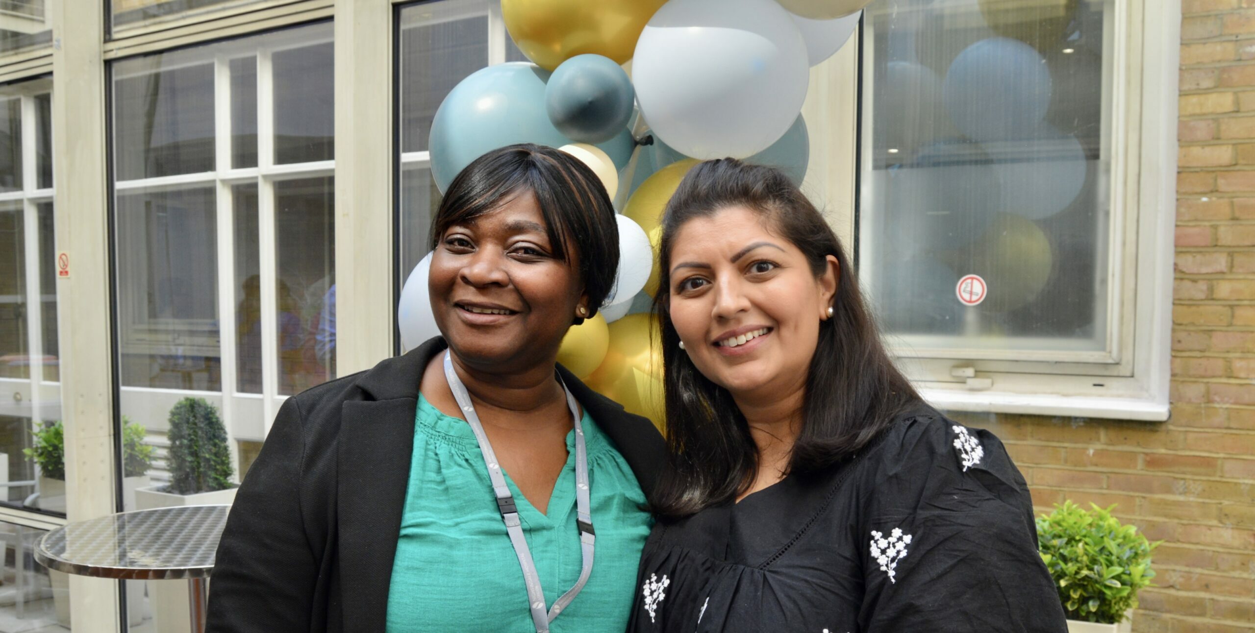 Two nurses celebrating the first anniversary of the OCD and related disorders inpatient unit